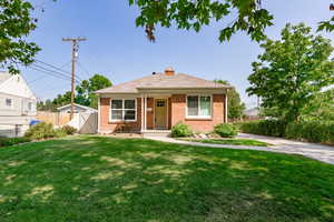 View of front of house featuring a front lawn