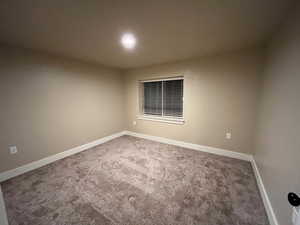 Empty room with carpet flooring