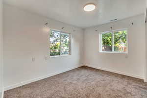 Spare room with carpet floors