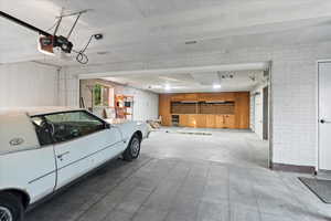 4 car tandem Garage with a work bend and storage.