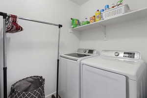 Laundry area with washing machine and clothes dryer