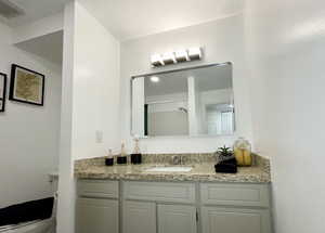 Bathroom with vanity and toilet