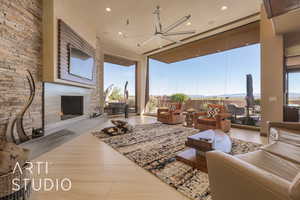 Living room featuring a stone fireplace