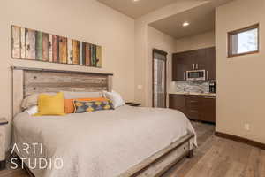 Bedroom with hardwood / wood-style floors