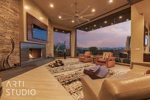 Living room with ceiling fan and a fireplace