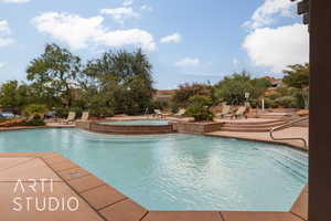 View of swimming pool with a patio area