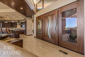 Foyer with a raised ceiling