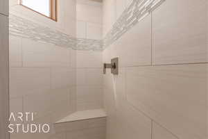 Bathroom featuring tiled shower