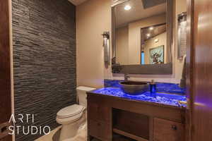 Bathroom featuring vanity and toilet