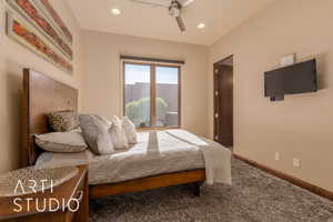 Carpeted bedroom with ceiling fan