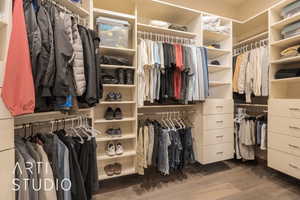 Walk in closet featuring dark hardwood / wood-style flooring