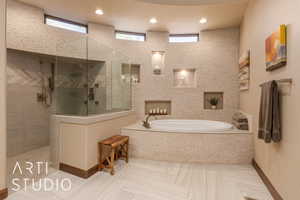 Bathroom with a healthy amount of sunlight and separate shower and tub