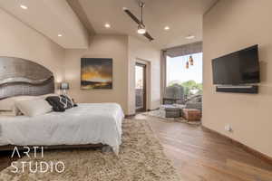 Bedroom featuring ceiling fan, hardwood / wood-style flooring, and access to outside