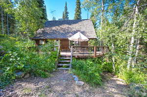 Rear view of property with a deck