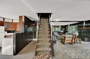 Stairs with a textured ceiling