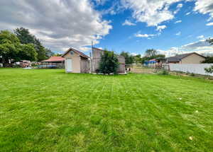 View of yard with a storage shed