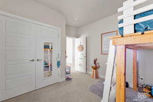 Bedroom with carpet flooring and a closet