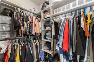 Primary bedroom walk in closet