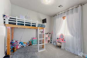 Bedroom featuring carpet flooring