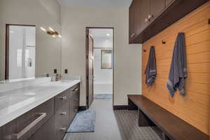 Bathroom with tile patterned flooring and vanity