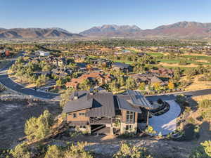 Birds eye view of property with a mountain view