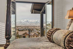 Bedroom featuring a mountain view and floor to ceiling windows