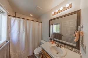 Bathroom with vanity and toilet