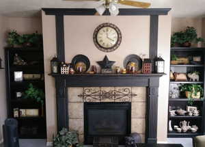 Details featuring a textured ceiling, ceiling fan, and a fireplace