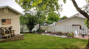 View of yard with a patio area