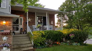 View of front of home with covered porch