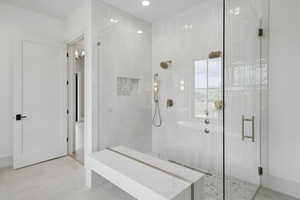 Full bathroom with a stall shower and recessed lighting