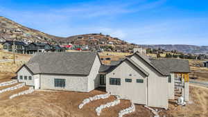 Rear view of house featuring a mountain view