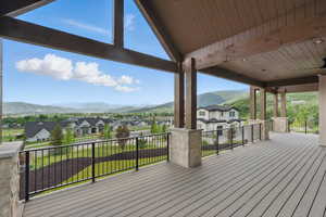 Wooden terrace with a mountain view and a residential view