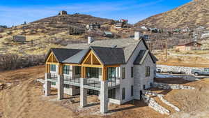 View of front facade featuring a mountain view and a balcony