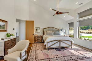 Master Bedroom featuring high vaulted ceiling, hardwood / wood-style flooring, and ceiling fan