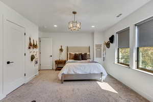 Bedroom with light carpet