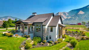 Exterior space with a mountain view and a yard