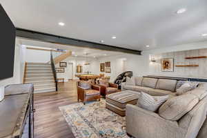 Living room with light hardwood / wood-style flooring