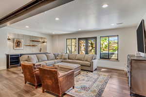 Living room with wood-type flooring and wine cooler