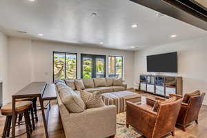 Living room with hardwood / wood-style floors