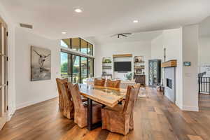 Dining space with hardwood / wood-style flooring