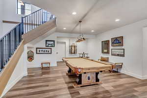 Rec room with billiards and wood-type flooring