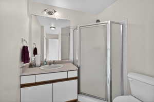 Full bath with vanity and a stall shower
