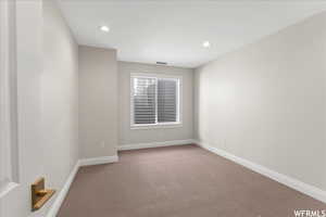 Empty room with carpet floors