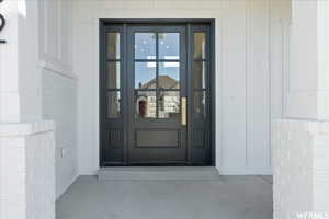 View of exterior entry featuring french doors