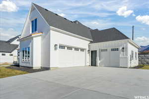 View of front facade featuring a garage