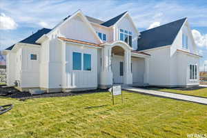 View of front of home featuring a front lawn