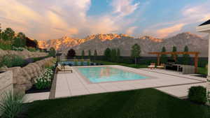 Pool at dusk with a patio, a yard, and a mountain view