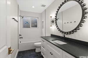 Full bathroom with vanity, toilet, shower / bathtub combination, and tile patterned flooring