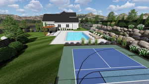 View of swimming pool featuring a lawn and a mountain view